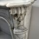 Louis XV style fireplace in veined white Carrara marble, 19th century.