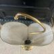 Metal umbrella stand with rigitulle and brass from the 1950s.