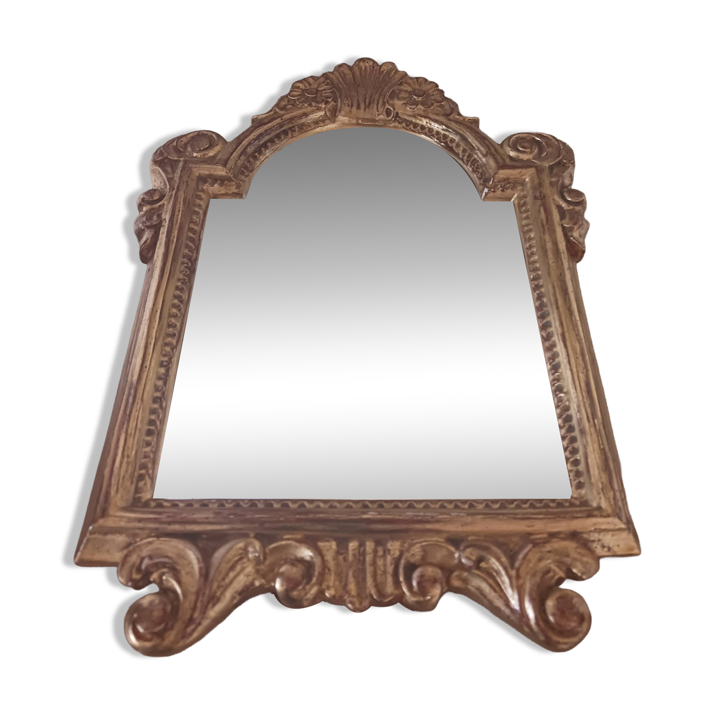 Antique mirror in gilded wood.