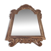 Antique mirror in gilded wood.