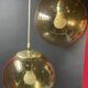 Pair of vintage smoked glass ball pendant lights from Biot glassworks