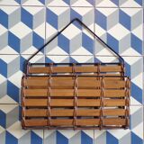 Vintage wall-mounted magazine rack