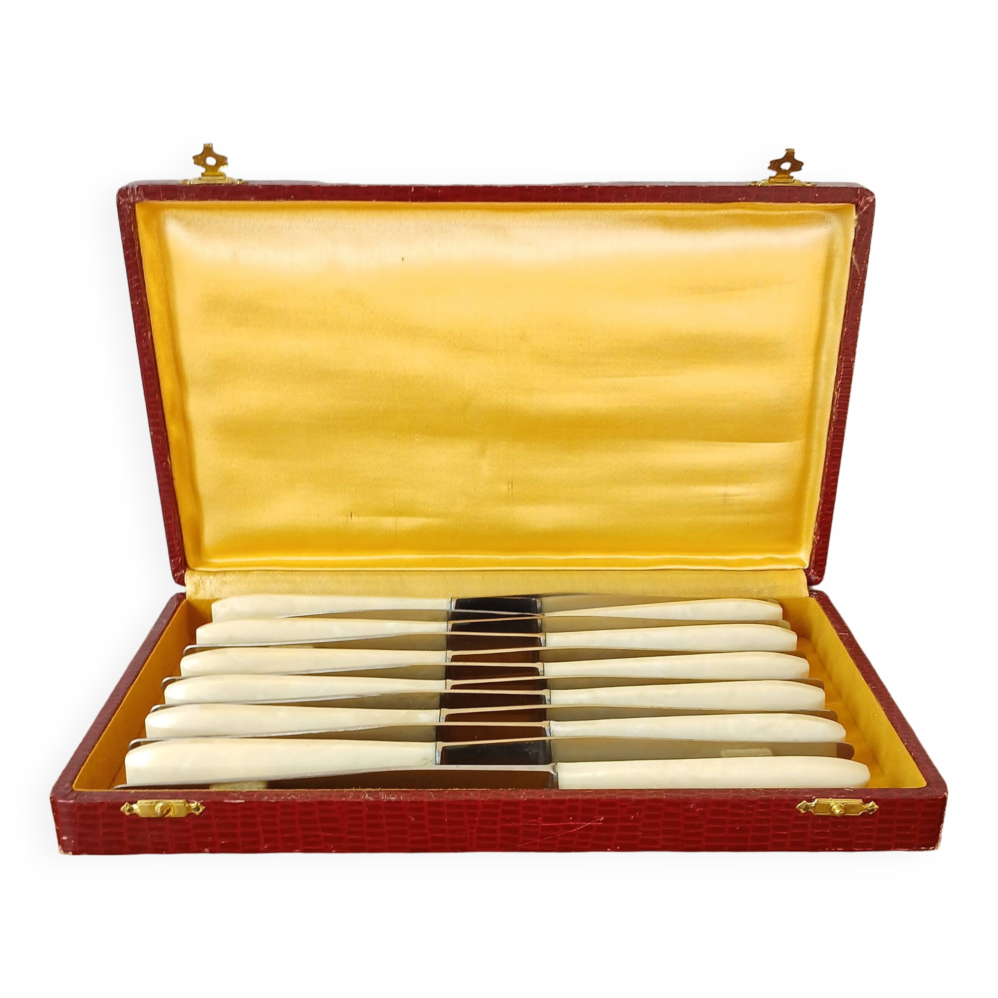 12 ivory & stainless steel bakelite knives in their case