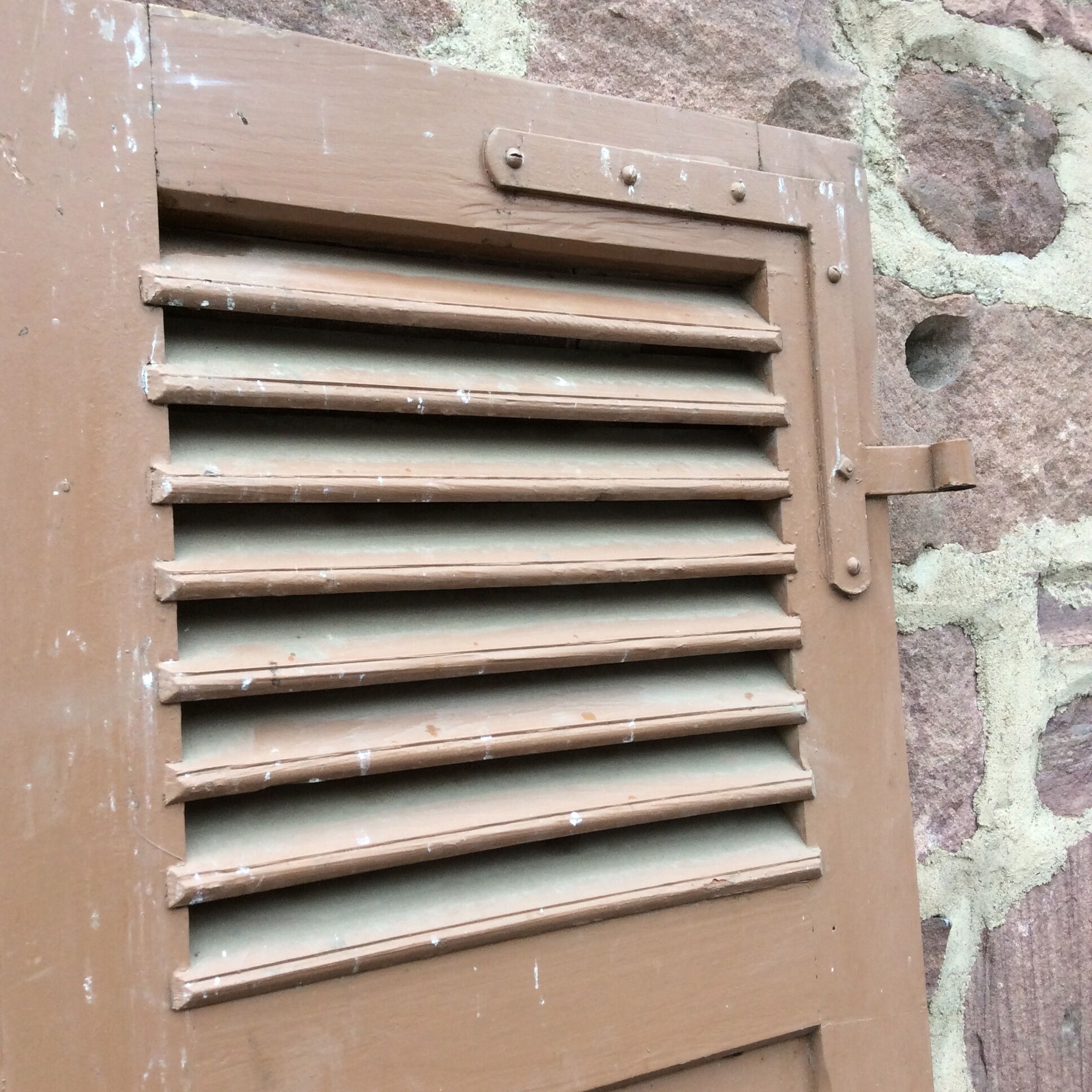 Pair of ancient shutters with wrought iron fittings