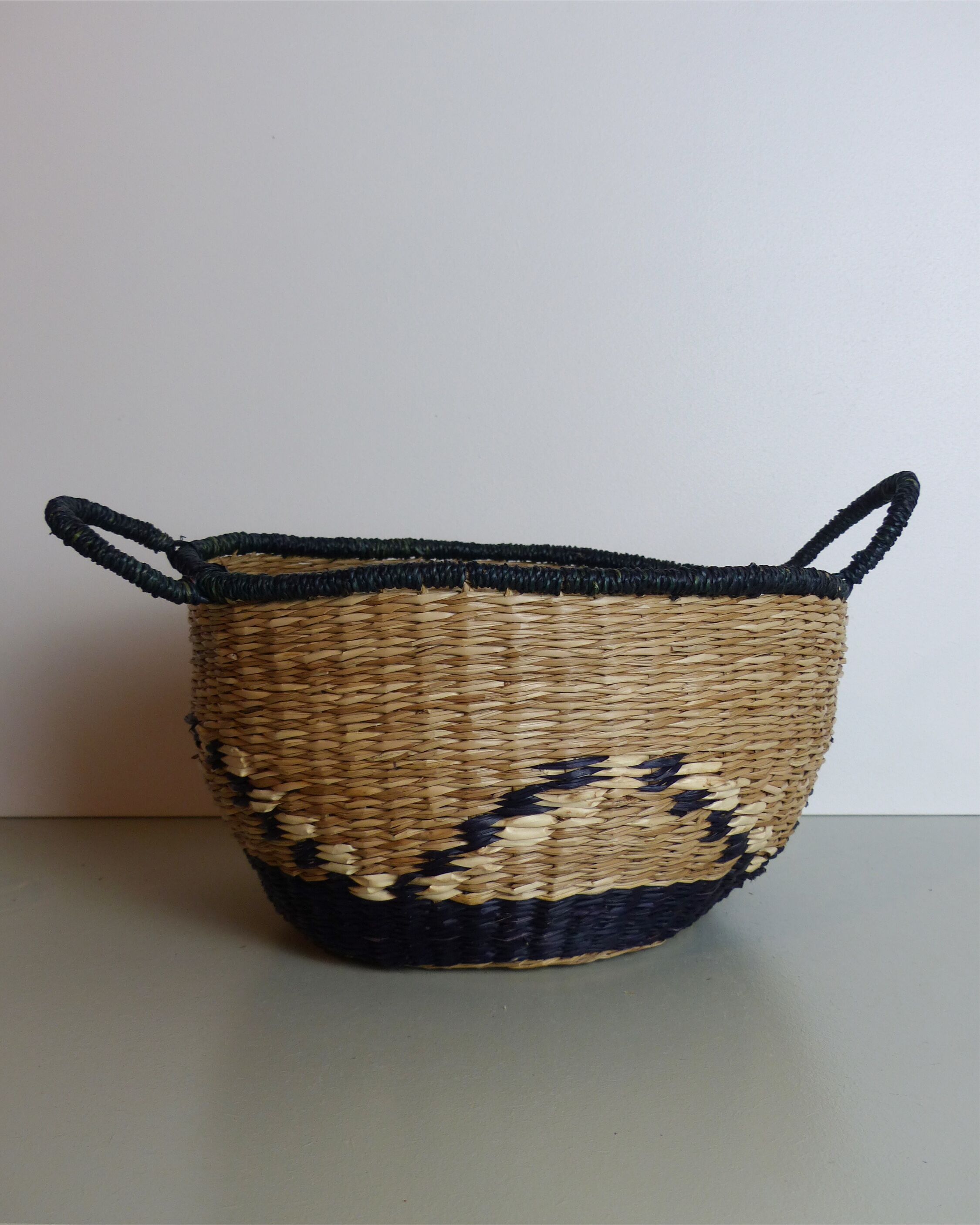 Vintage basket in black and beige raffia