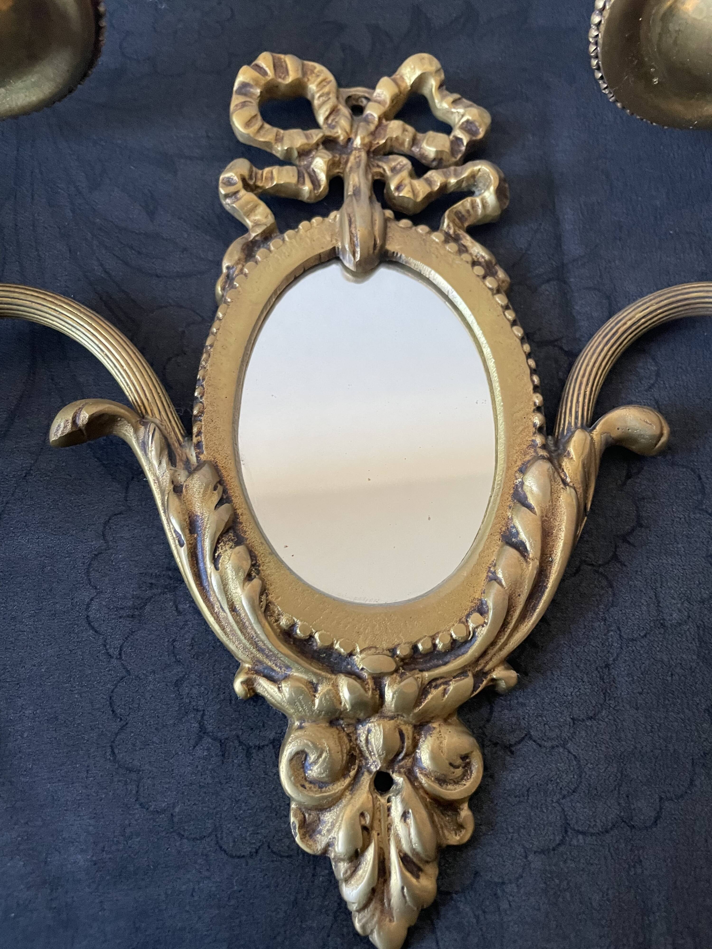 Pair of bronze wall lamps with mirror