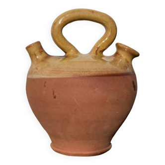 Gargoulette or old jug in yellow glazed terracotta