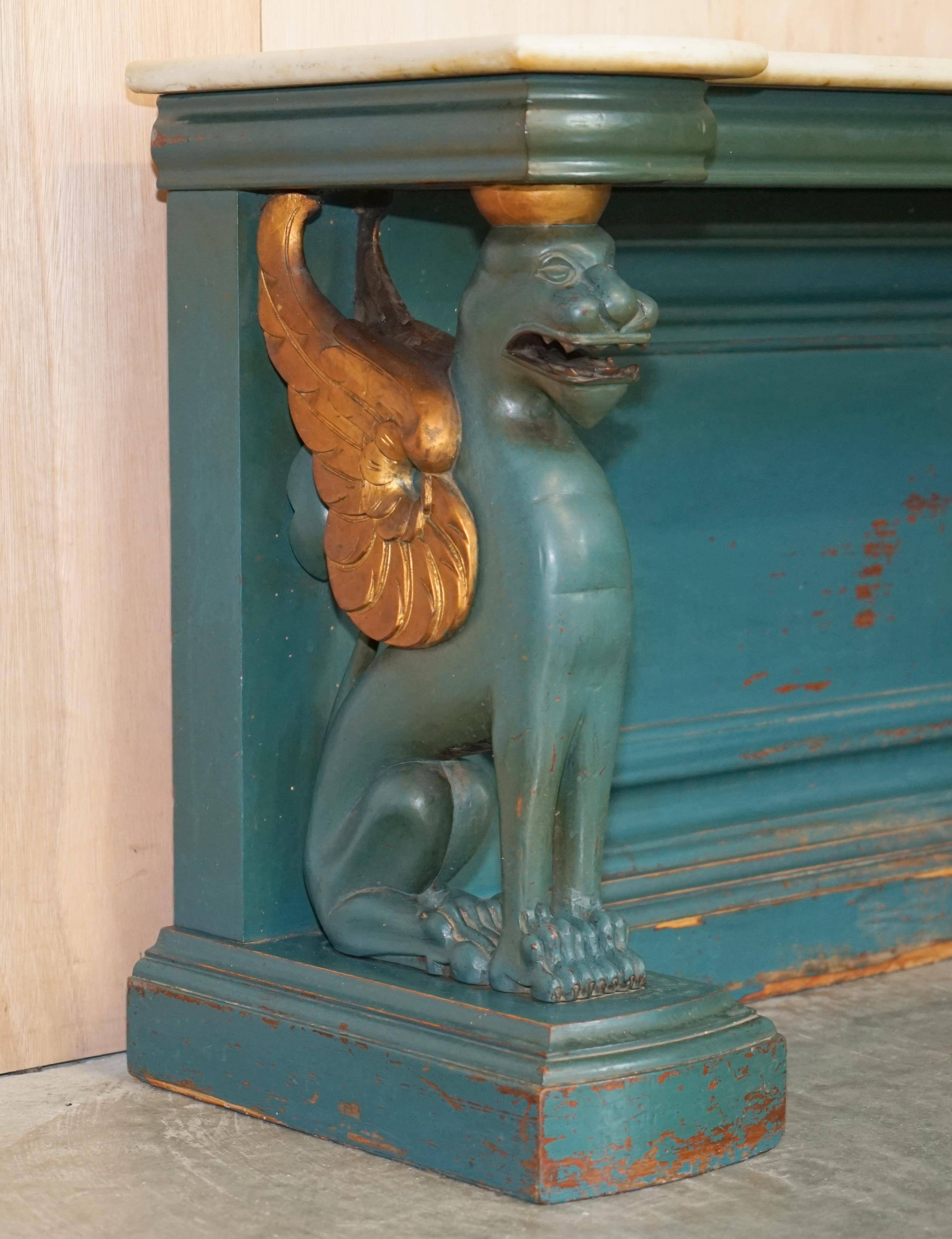 Antique hand-carved console circa 1880 with a marble top.