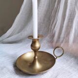 Large hand candlestick in gilded brass