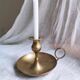 Large hand candlestick in gilded brass