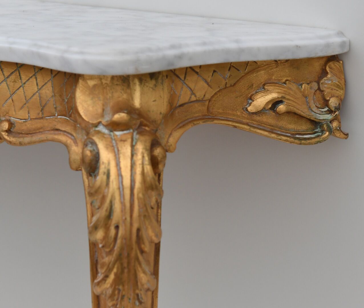Rocker-style gilded wooden console