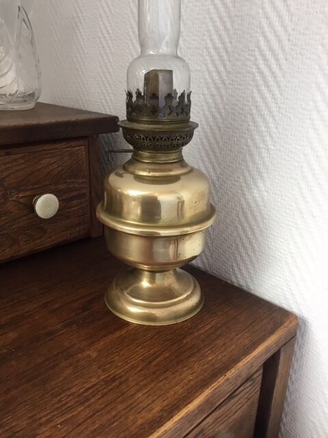 Old-fashioned brass standing oil lamp