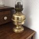 Old-fashioned brass standing oil lamp