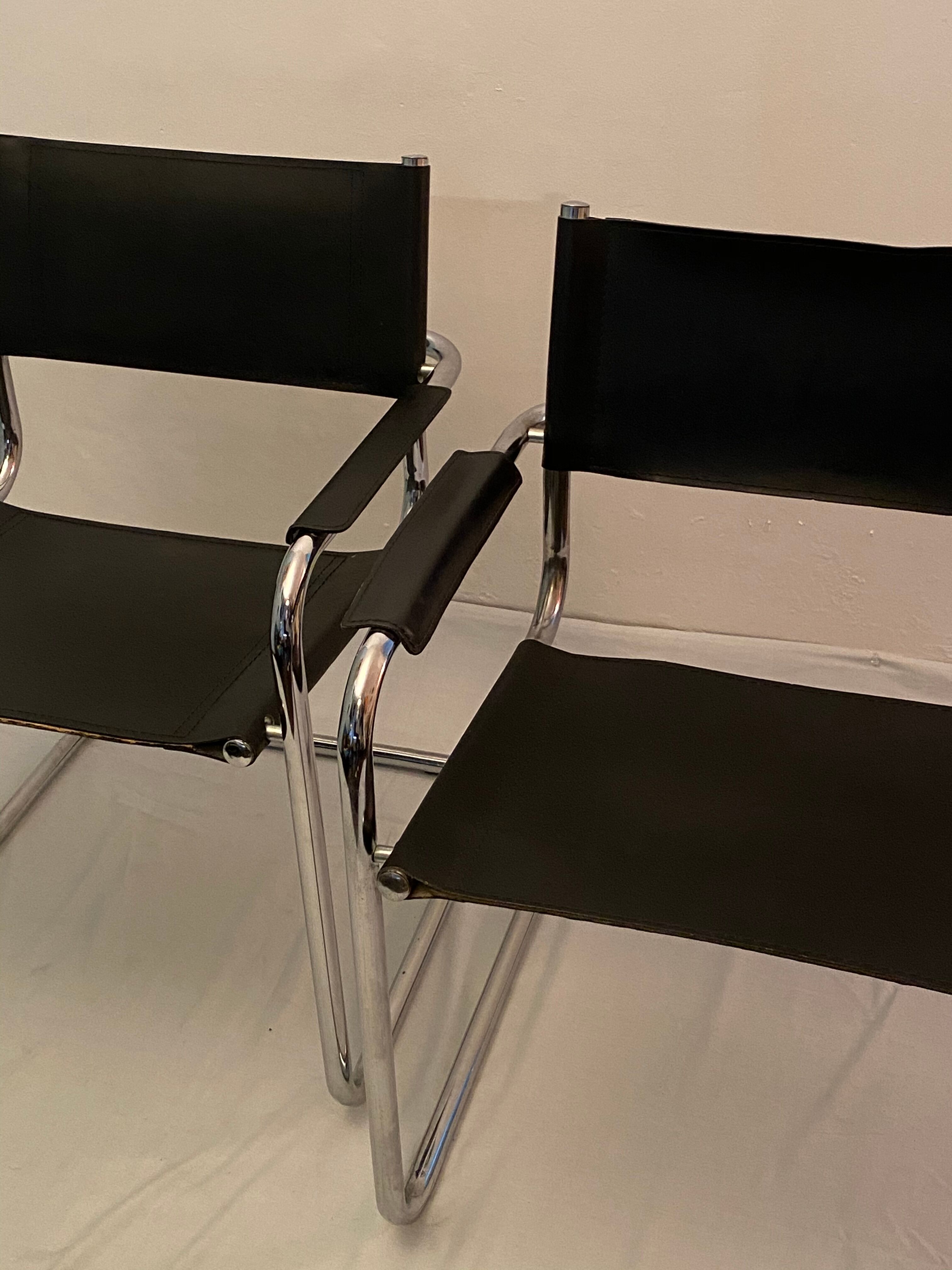 Pair of chrome and leather tube chairs