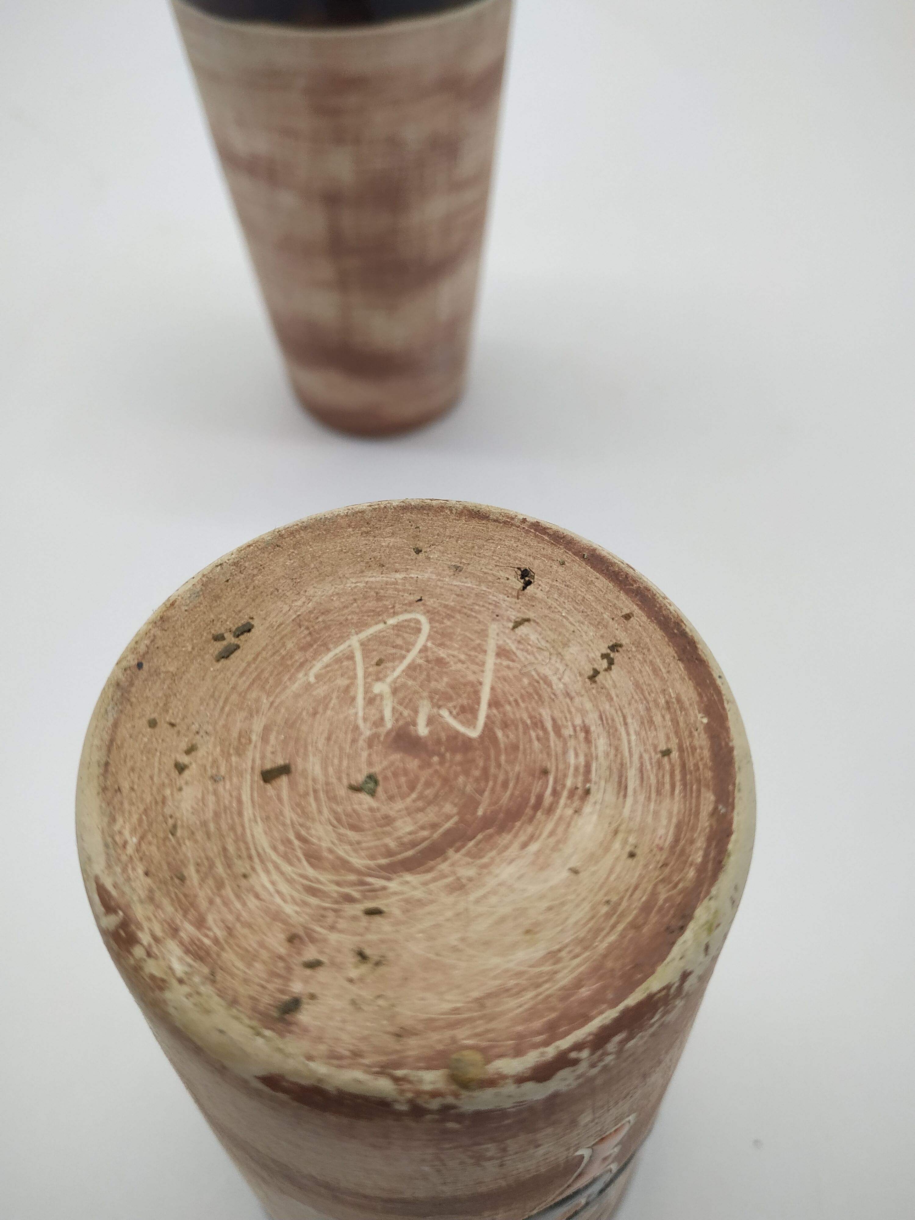 Pair of vintage enamelled terracotta mugs