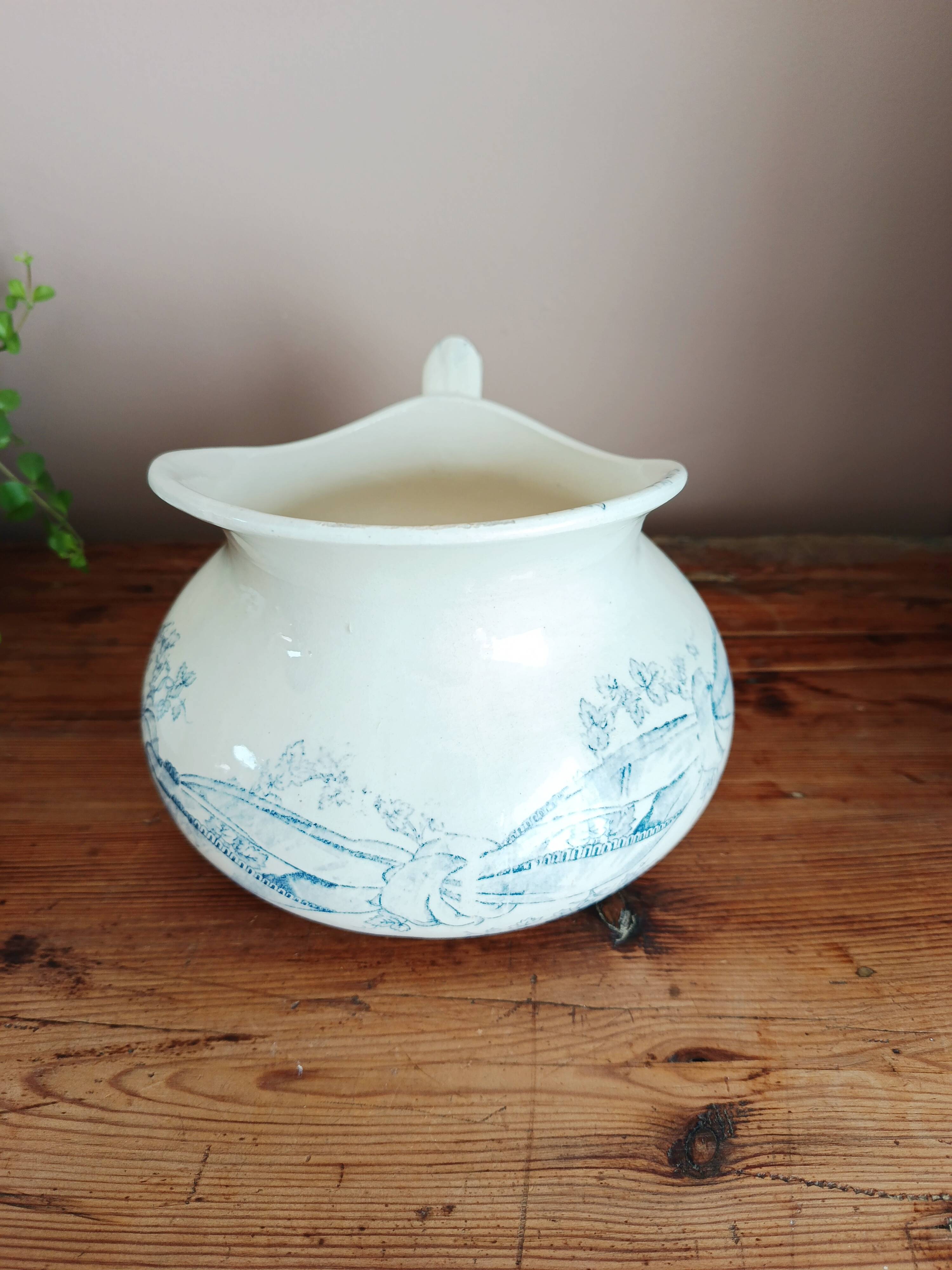 Old bulbous jug in ironstone earthenware