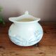 Old bulbous jug in ironstone earthenware