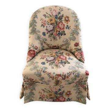 Vintage floral armchair with charm.