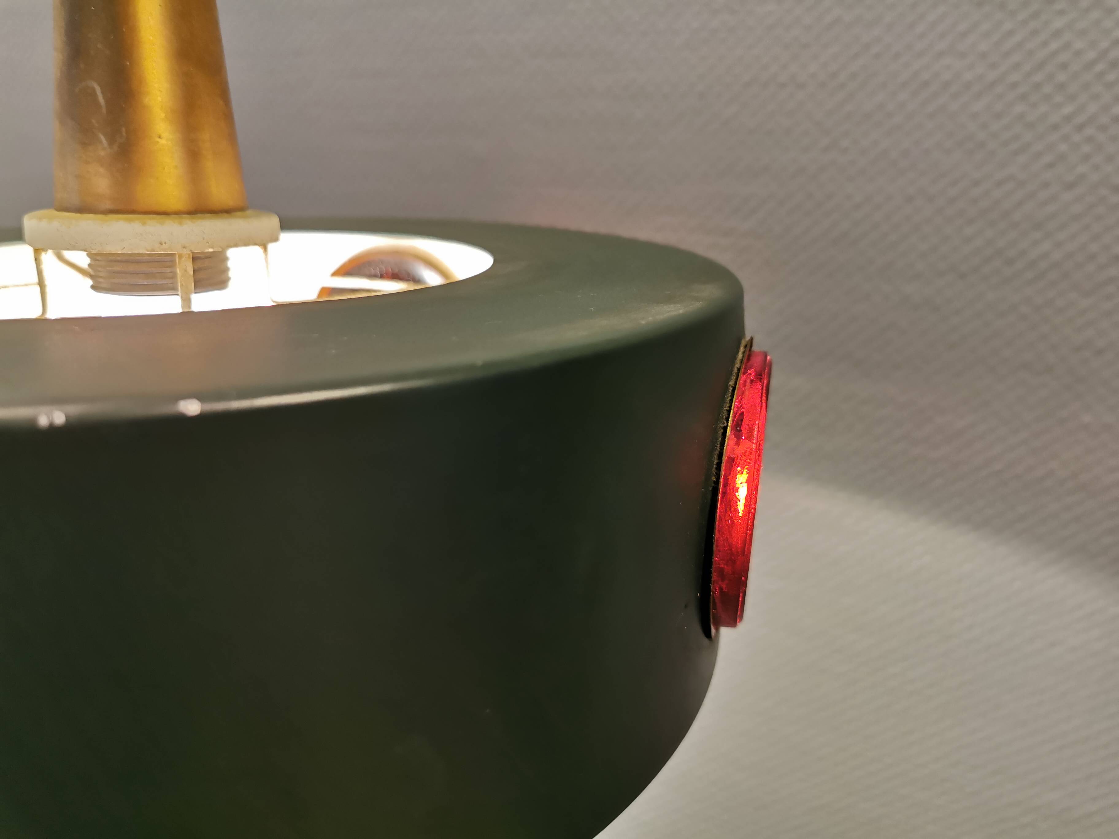 Swedish hanging lamp, in dark green lacquered metal with red glass prisms and brass top/suspension.