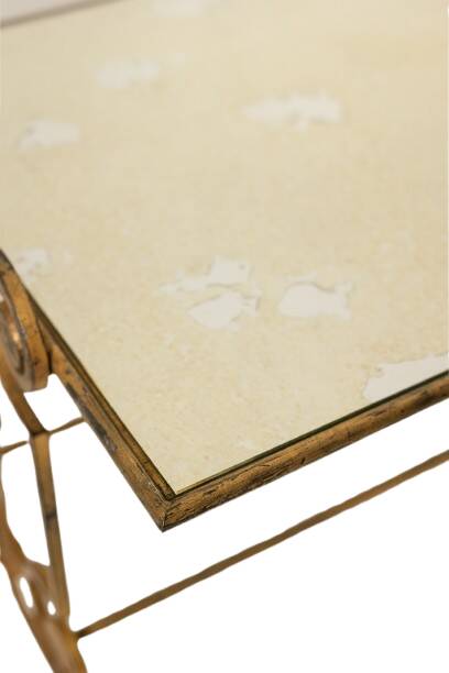 Gold wrought iron coffee table with a mirrored glass top. 1970s.