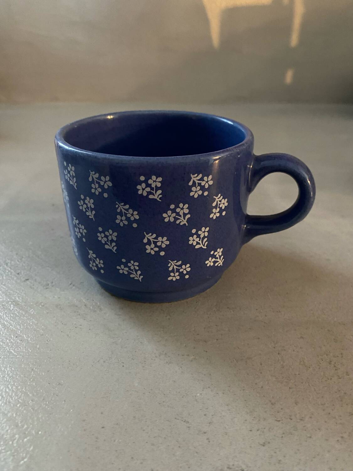 Vintage blue cup with flower decor