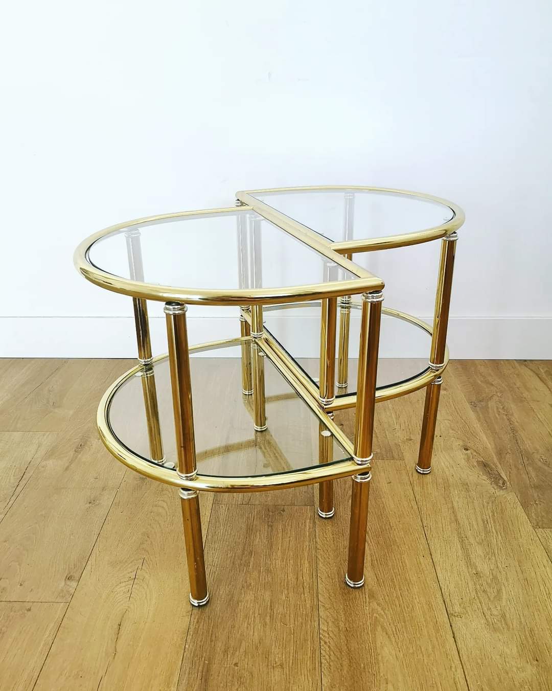 Pairs of gilded metal bedside tables and glass tops