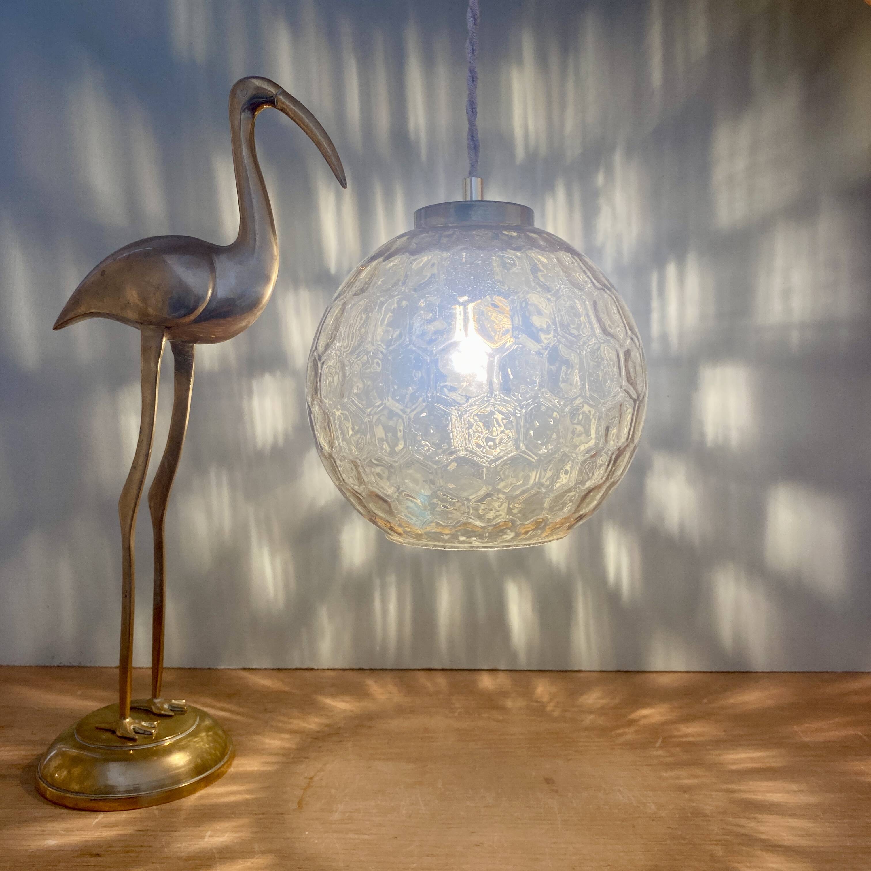 Vintage globe pendant light in amber glass