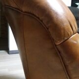 Brown leather armchair