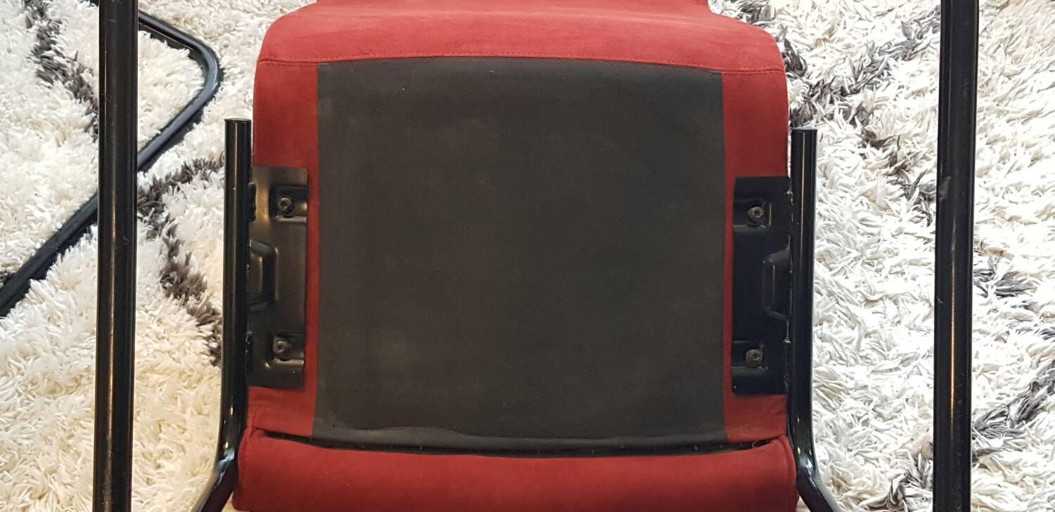 Red suede chairs, Knoll.