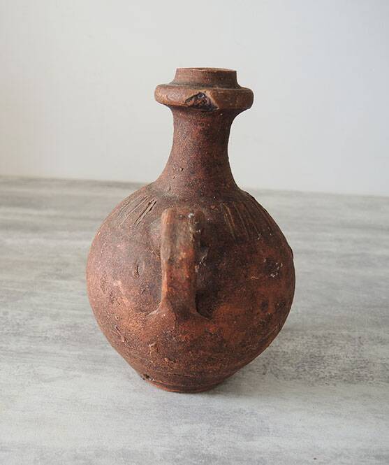 Old anthropomorphic terracotta vase pitcher