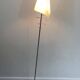 Pair of designer parquet floor lamps composed of lacquered metal and chrome bases and designer white plastic lampshades