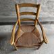 Straw chair with armrests, France