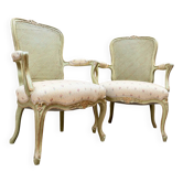 A pair of lacquered wooden armchairs in Louis XV style, 19th century.
