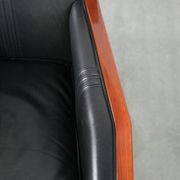 Black leather and wooden Art Deco design armchair