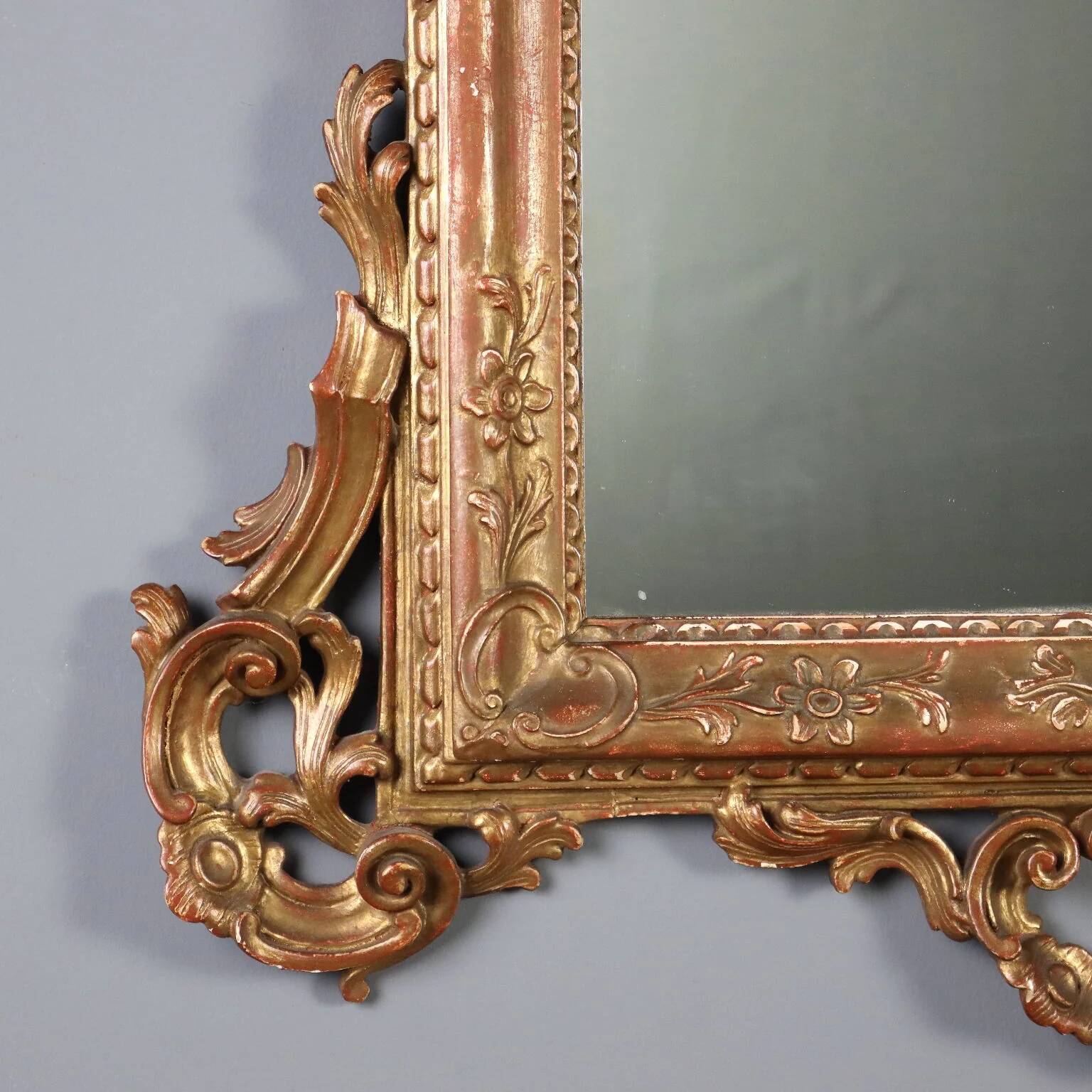 Antique carved and gilded wooden mirror, Italy, early 20th century.