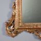 Antique carved and gilded wooden mirror, Italy, early 20th century.