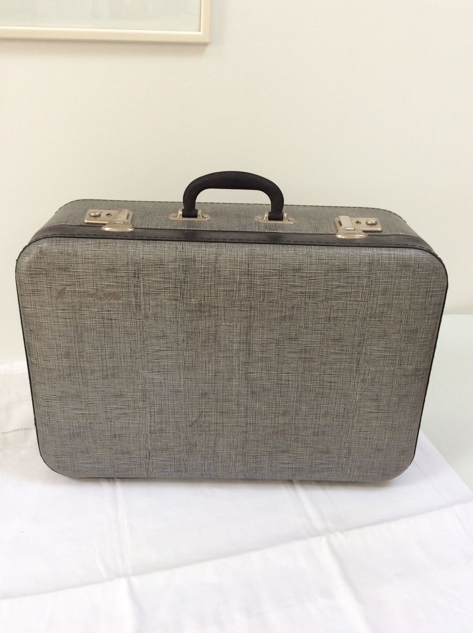 Old gray cardboard suitcase