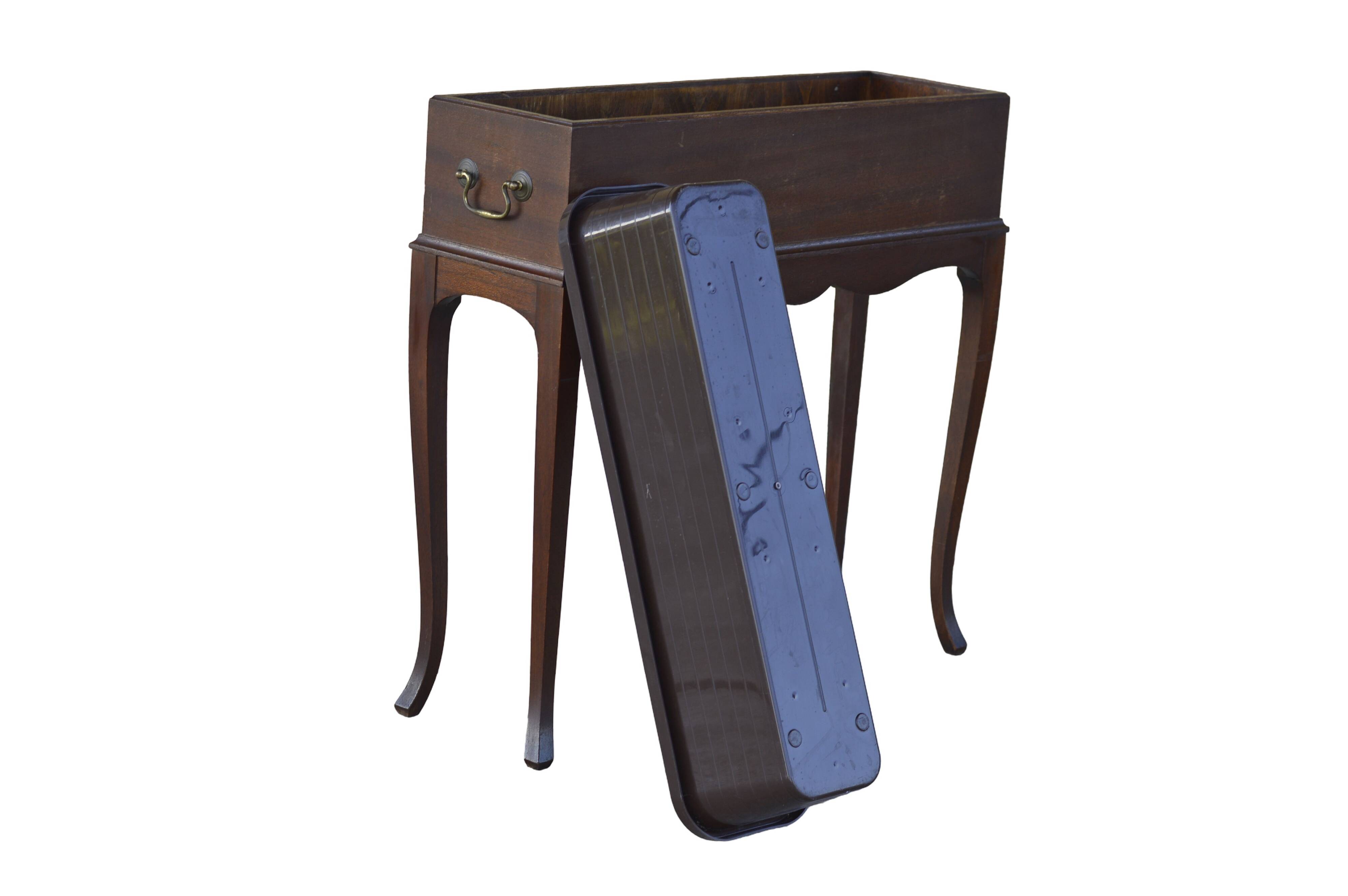 Elegant mid-century teak planter with tray.