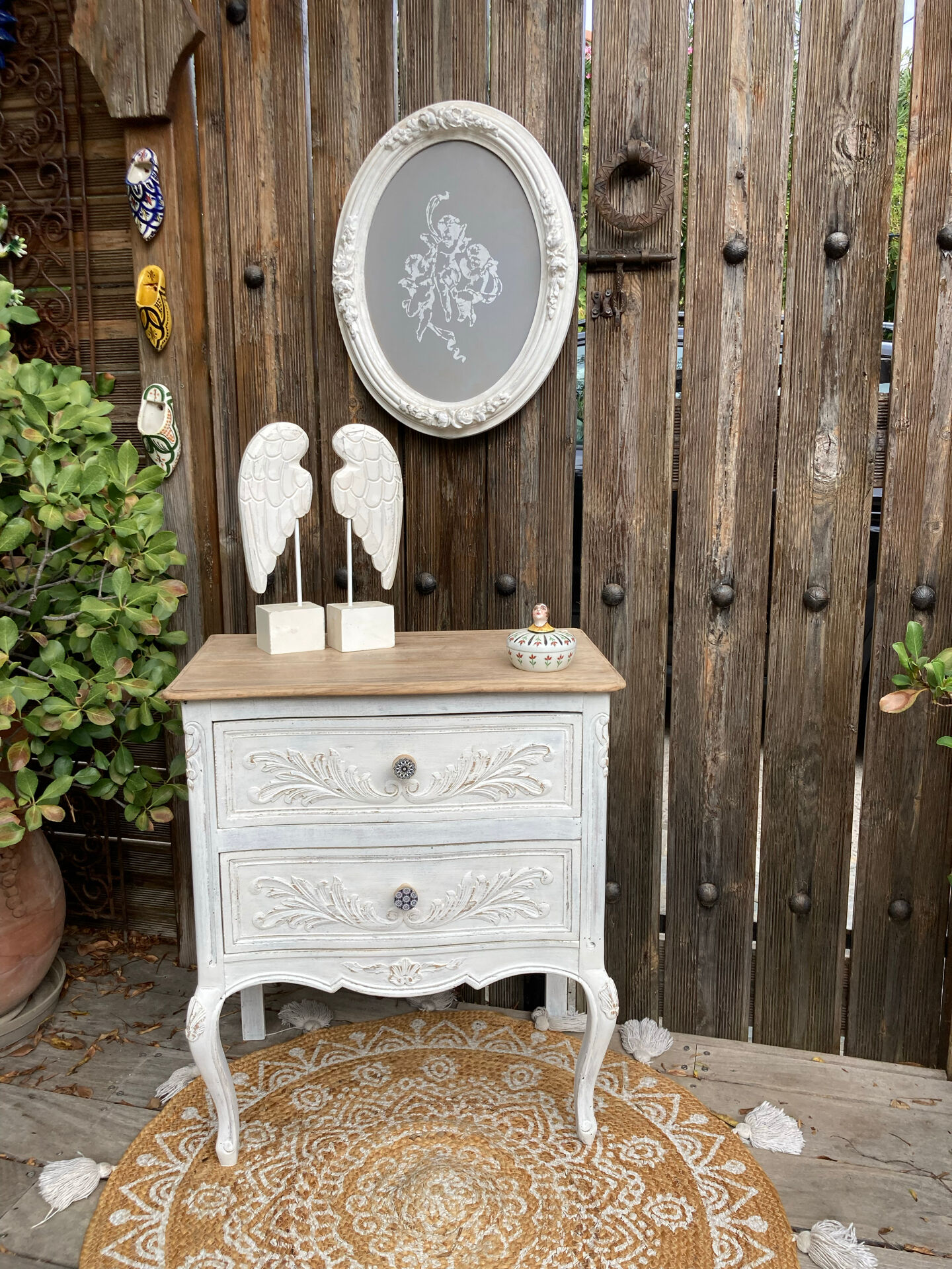 Adorable small chest of drawers or weathered white console.