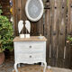 Adorable small chest of drawers or weathered white console.