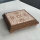 Vintage wooden and antique earthenware trivet, brown tile design