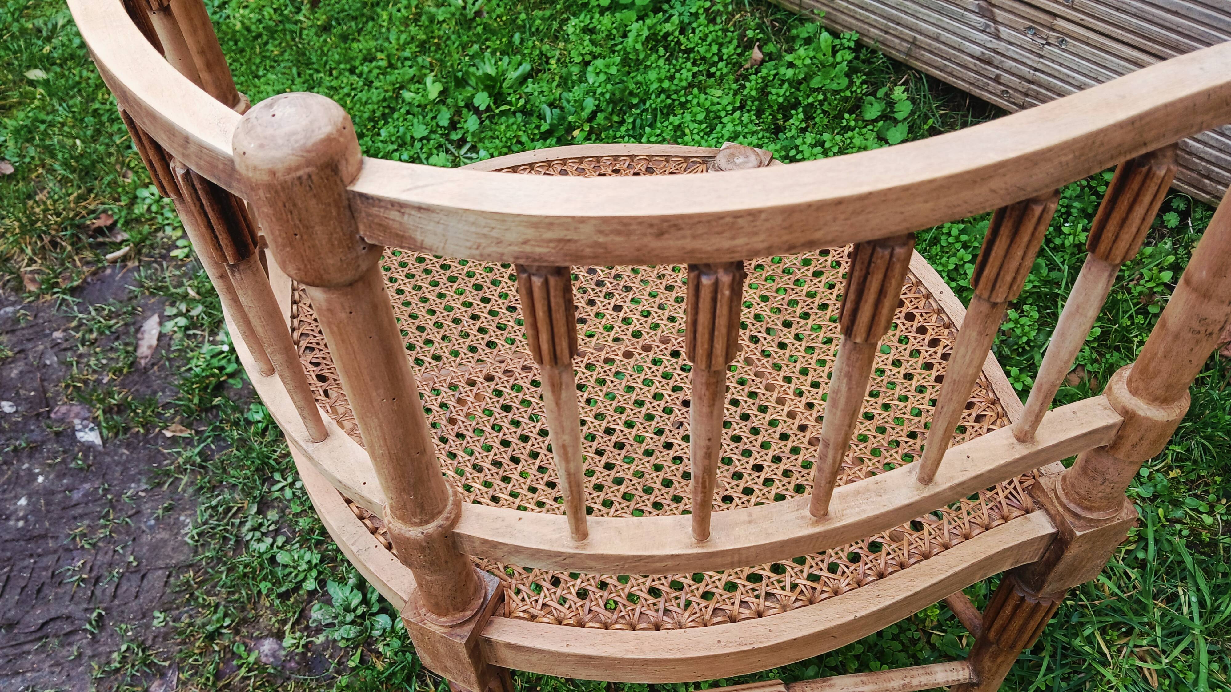 Corner chair in beech, caned seat from the early 20th century.