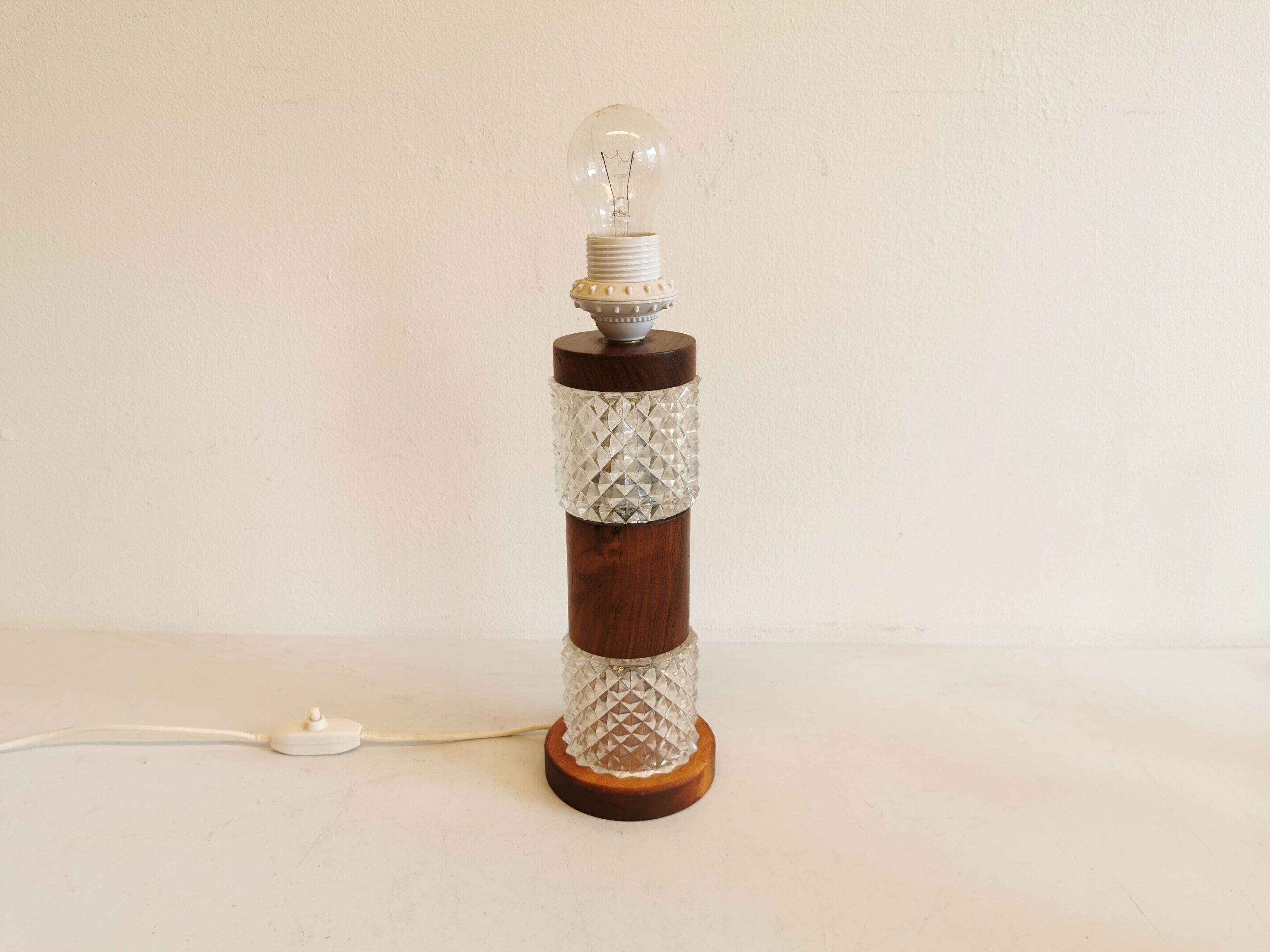 Swedish table lamp, made of what looks like rosewood and crystal glass.