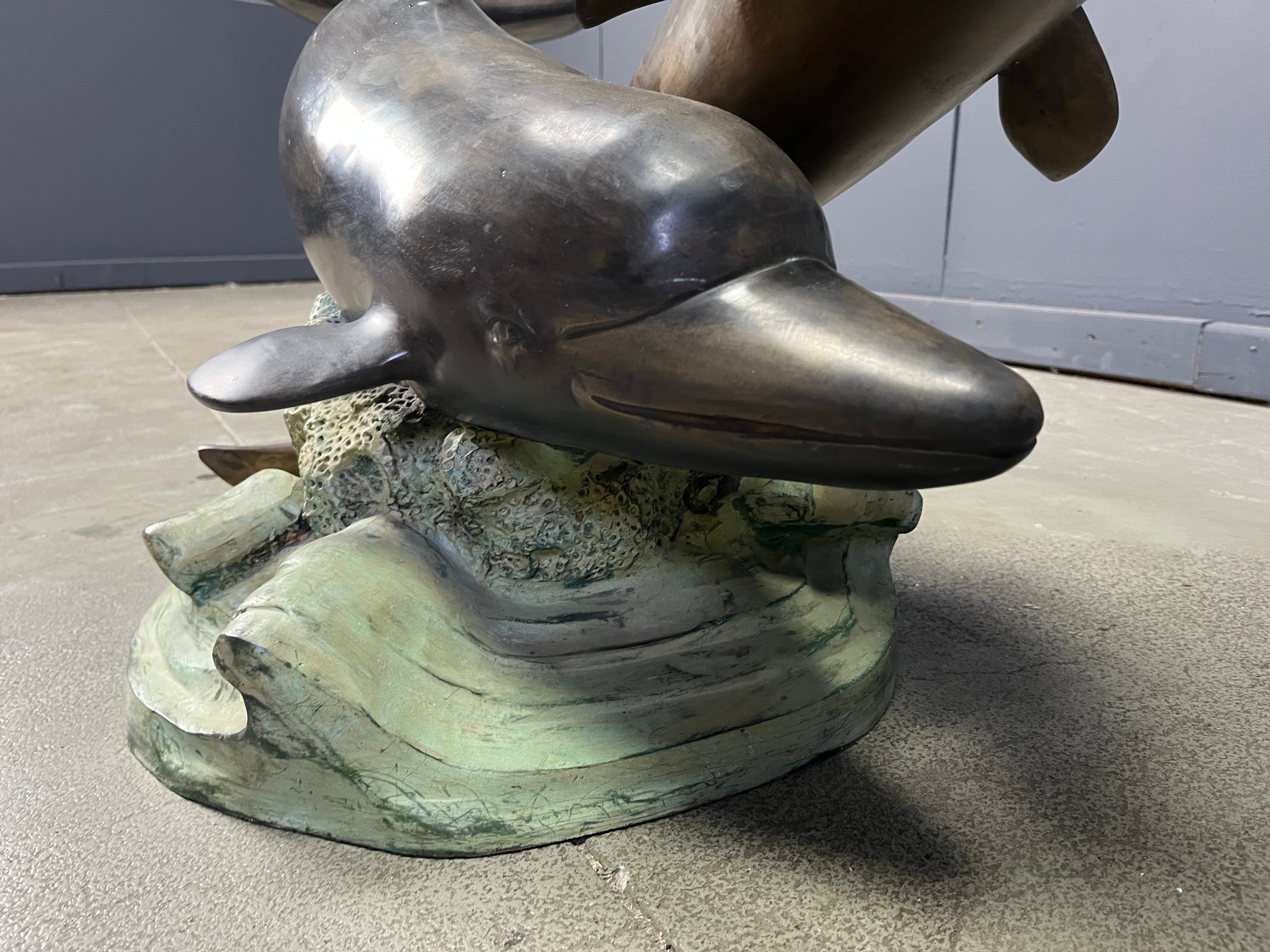 Bronze dolphin coffee table signed C Caudion, 1960s