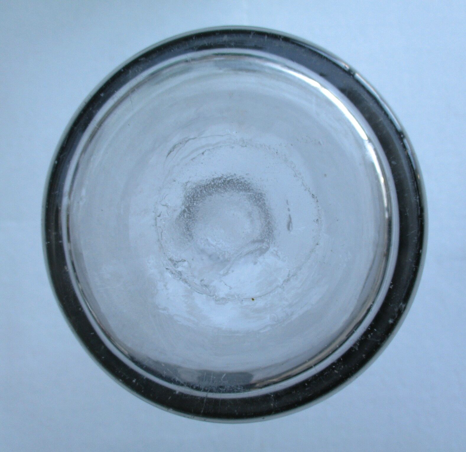 Large antique bottle made of blown glass