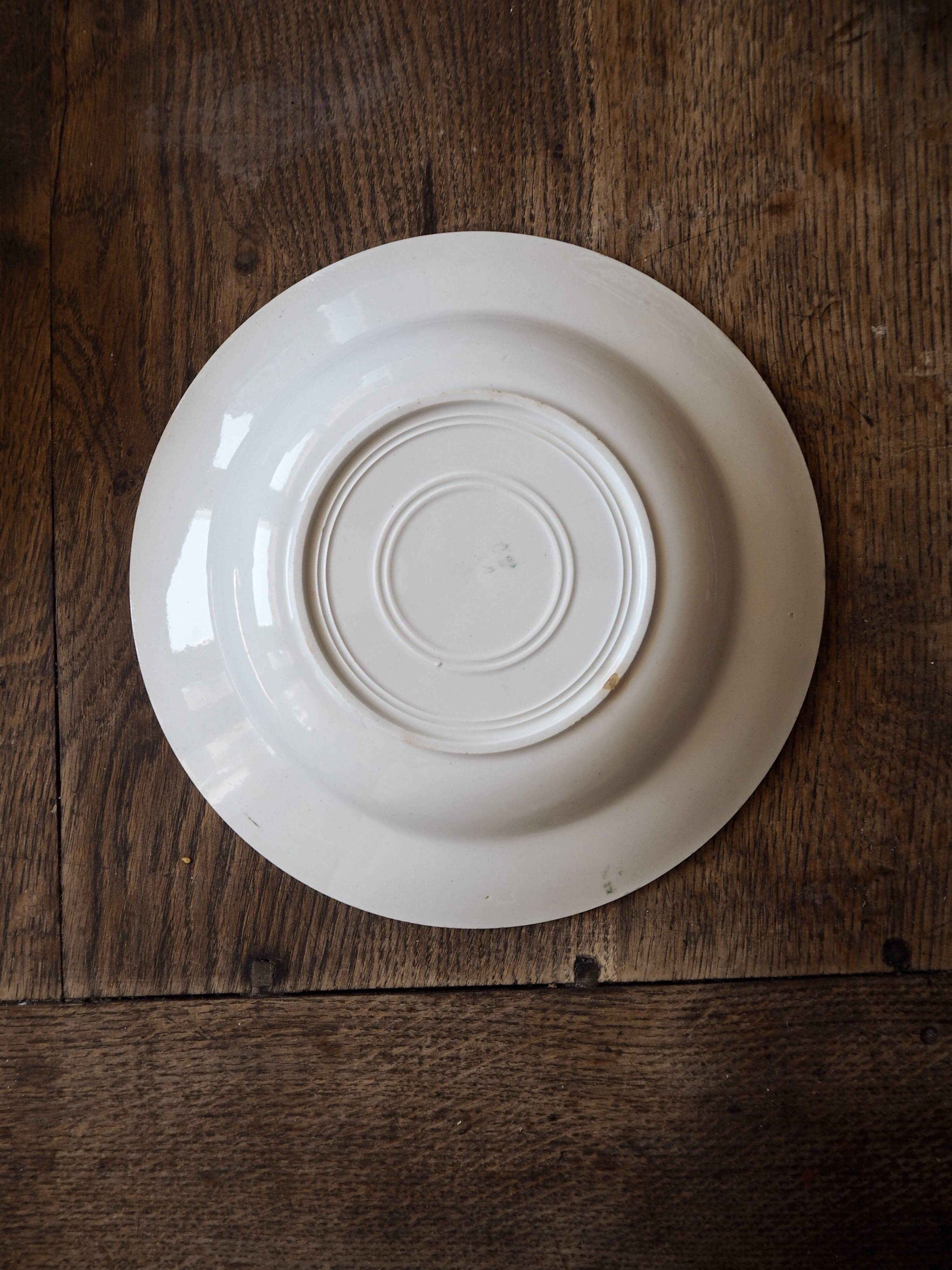 Set of 12 green patterned soup plates, Badonviller earthenware
