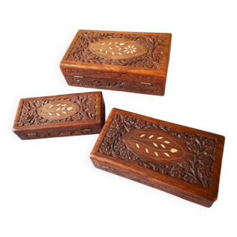 Antique hand-carved wooden boxes.