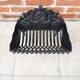 Old cast iron log cradle with backrest