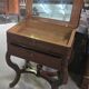 Dresser or vanity table from the Charles X / Empire period in mottled mahogany.