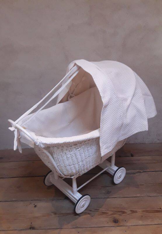 Wicker and painted wood baby cradle